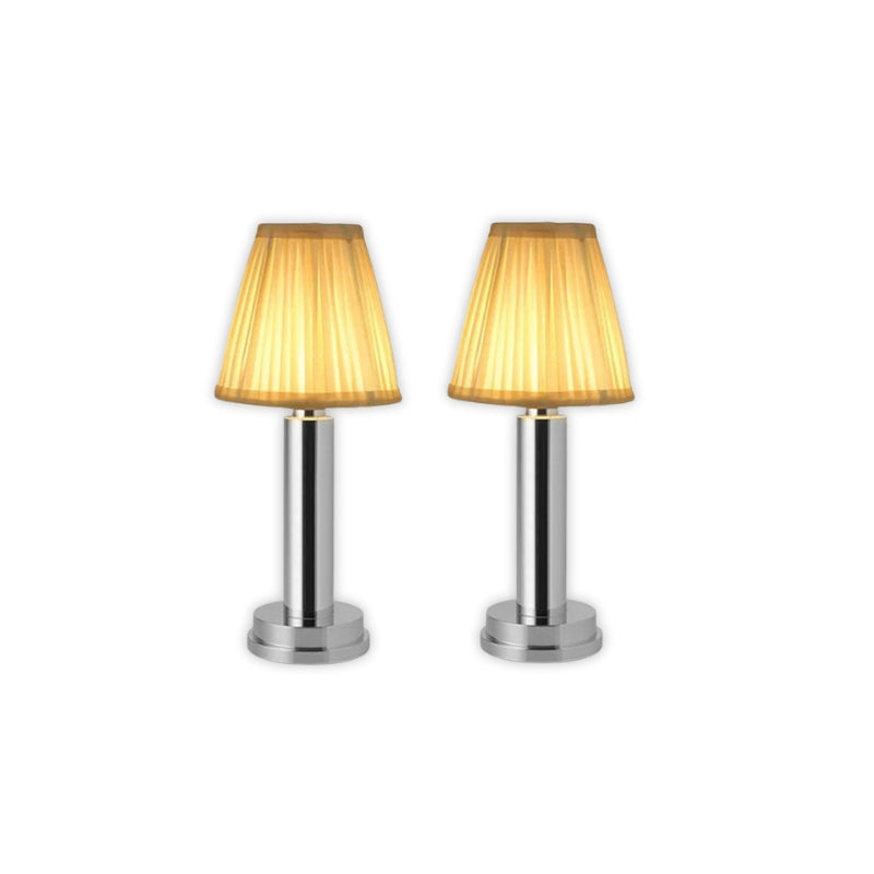 Two table lamps with gold lampshades on a white background