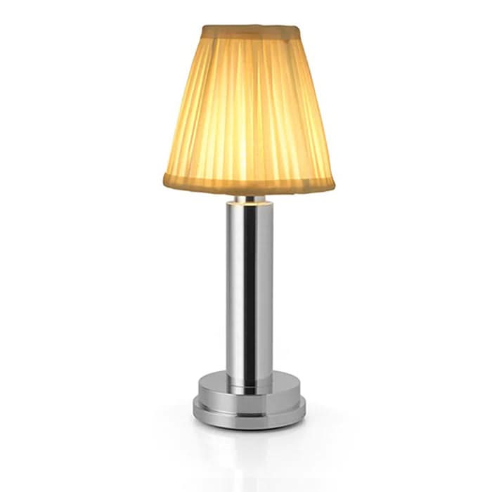Table lamp with a yellow pleated shade on a white background