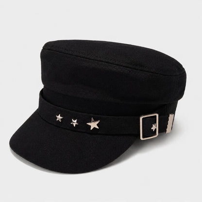Josh & Tate - StarHat™ Retro Beret - A black military-style cap with a structured crown, a curved brim, a black band decorated with three silver star studs, and a silver buckle on the side, shown against a light gray background.