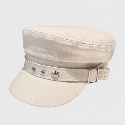 Josh & Tate - StarHat™ Retro Beret - A light beige canvas military-style cap with a matching fabric chin strap adorned with three metallic star pins and a silver buckle, shown against a light gray background.