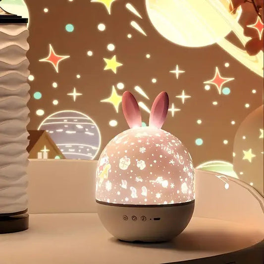 Children's night light with bunny ears projecting stars and moon on a wall.