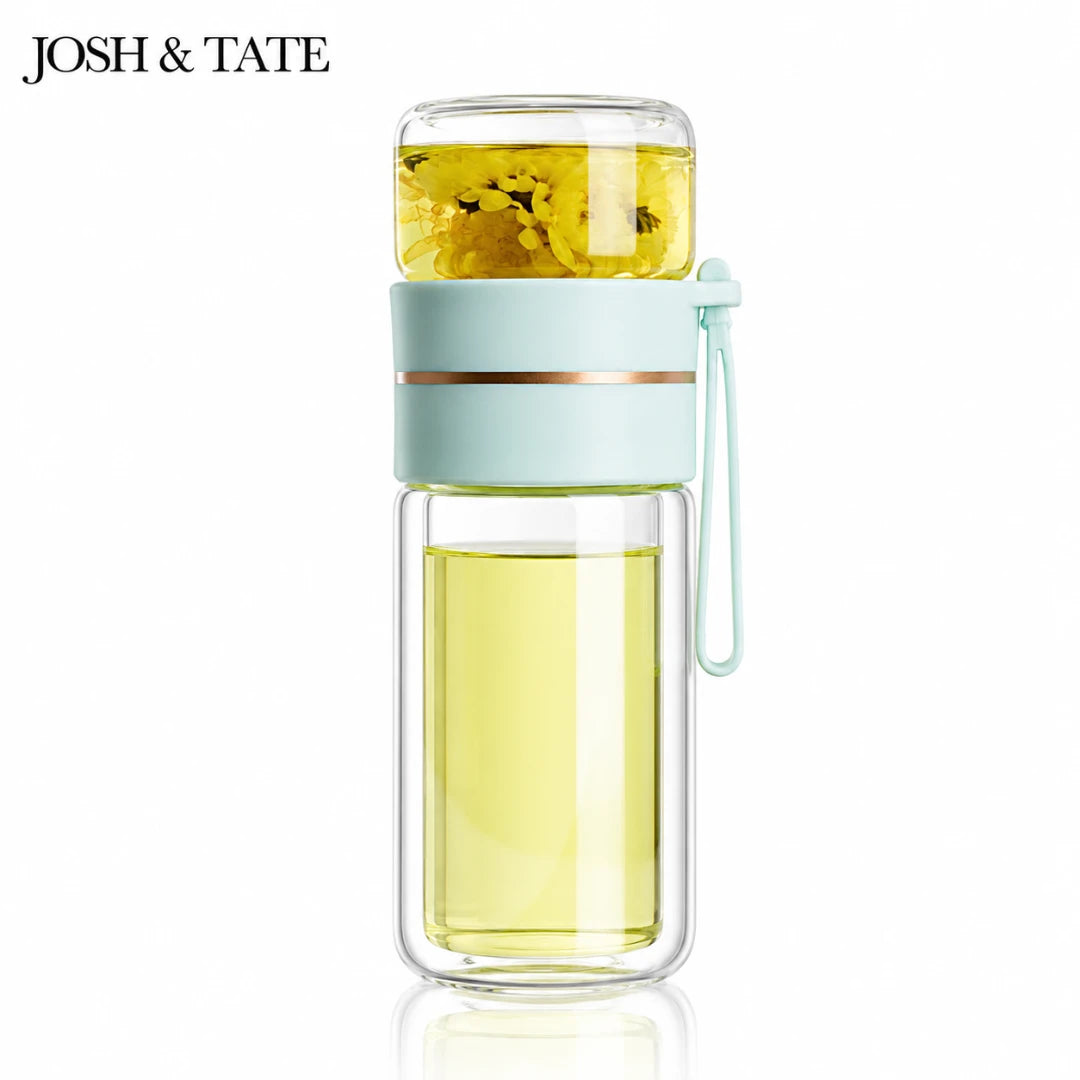 Josh & Tate - SteepSeal™ Tea-Water Separation Bottle - Glass infuser bottle with green liquid and lemon slices, branded 'Josh & Tate'.