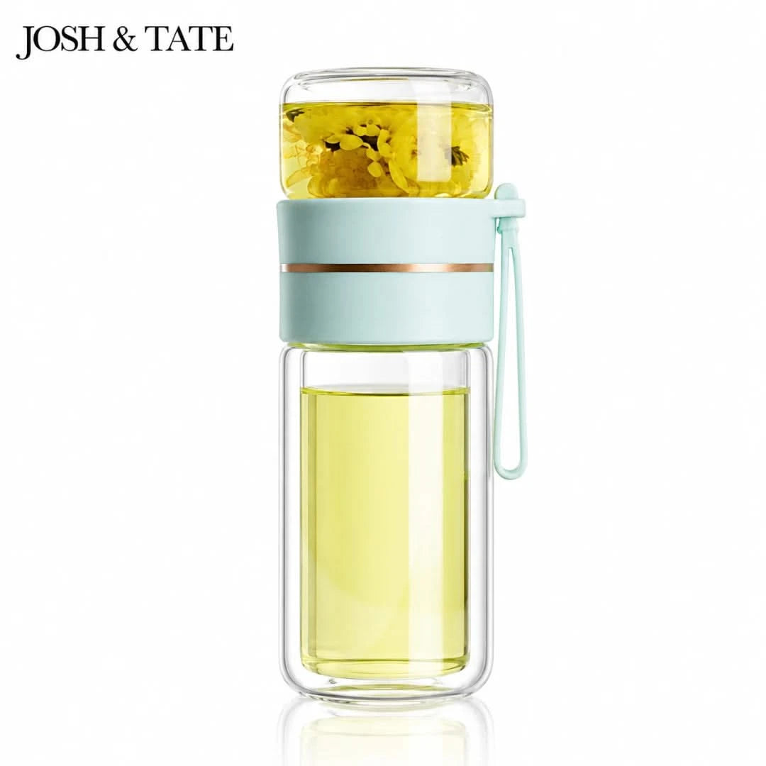 Josh & Tate - SteepSeal™ Tea-Water Separation Bottle - Glass infuser bottle with green liquid and lemon slices, branded 'Josh & Tate'.