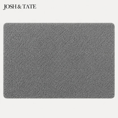 Josh & Tate - StepDry™ Anti-Slip Bath Mat - Gray textured mat with 'Josh & Tate' branding on a white background