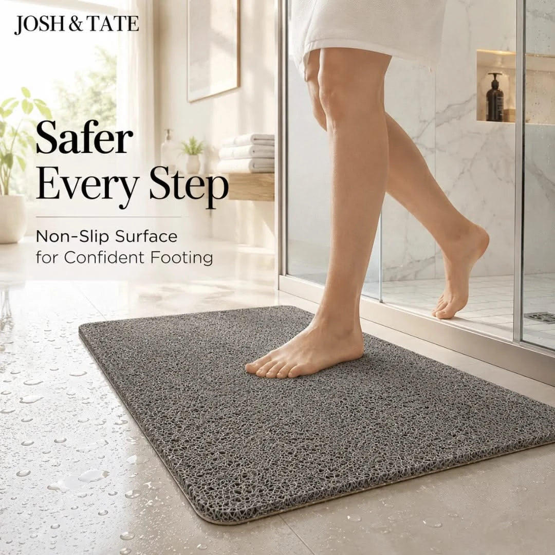 Josh & Tate - StepDry™ Anti-Slip Bath Mat - Gray bath mat with person stepping onto it, featuring Josh & Tate branding.