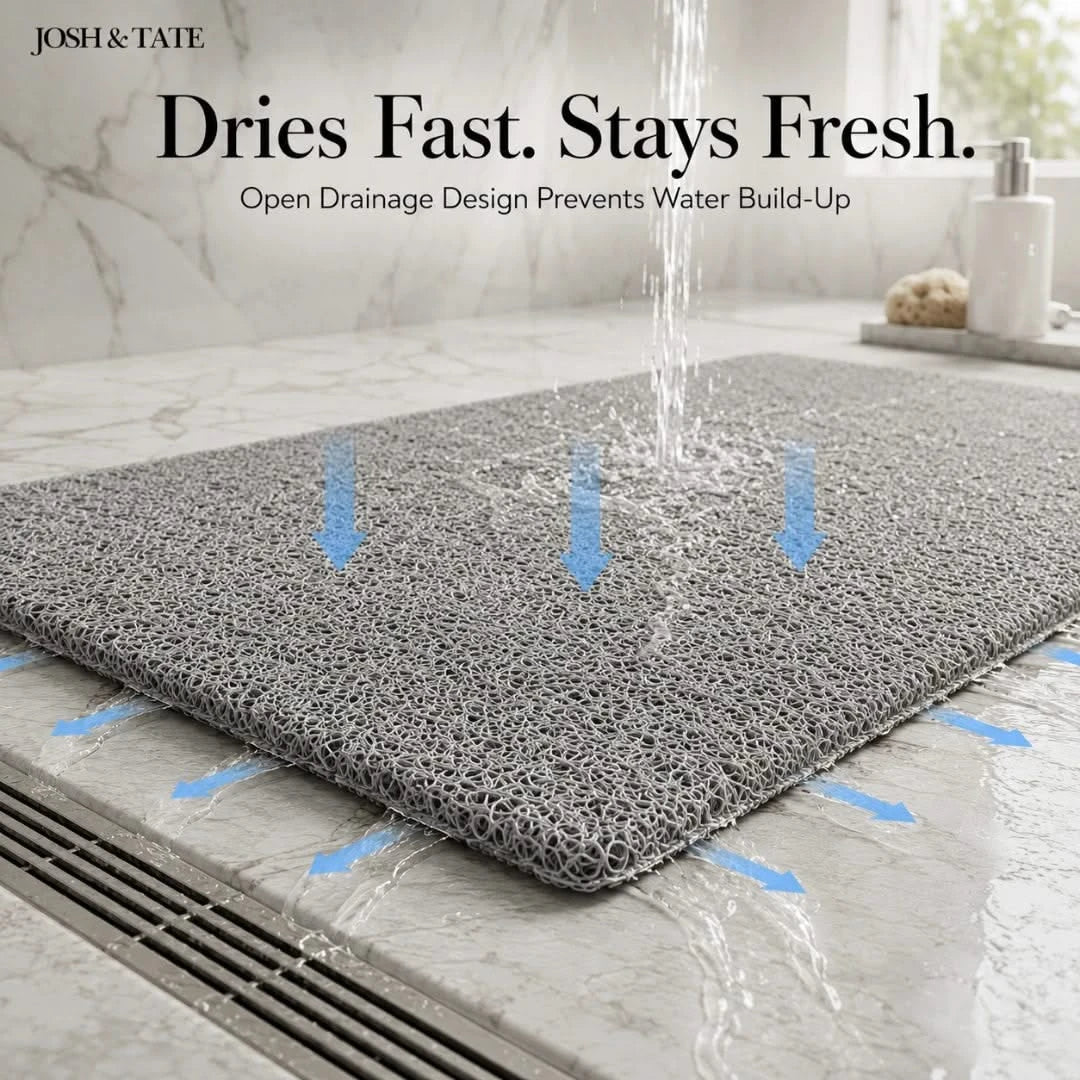 Josh & Tate - StepDry™ Anti-Slip Bath Mat - Gray bath mat with water drainage design on a bathroom floor, featuring Josh & Tate branding.