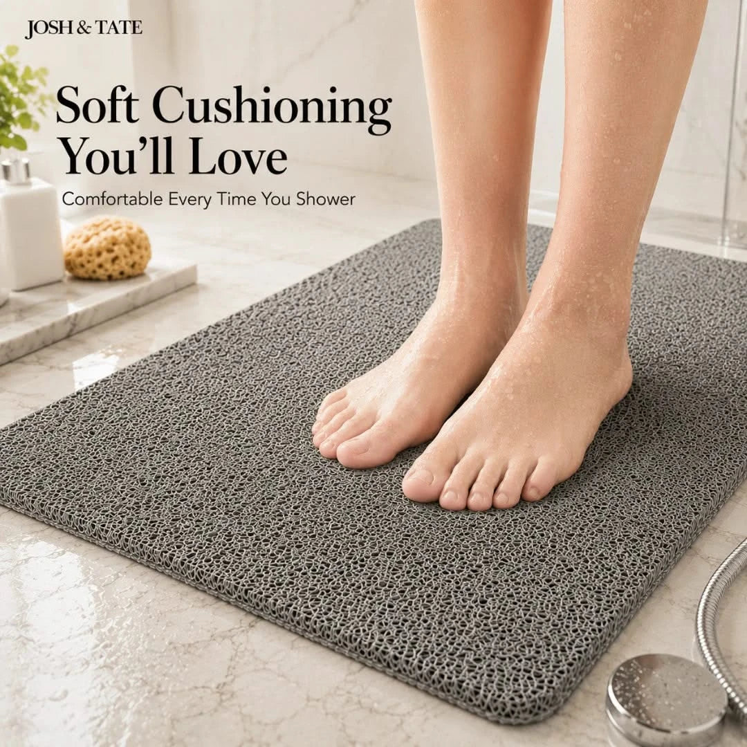 Josh & Tate - StepDry™ Anti-Slip Bath Mat - Person standing on a textured bath mat with 'Josh & Tate' branding and text about soft cushioning.