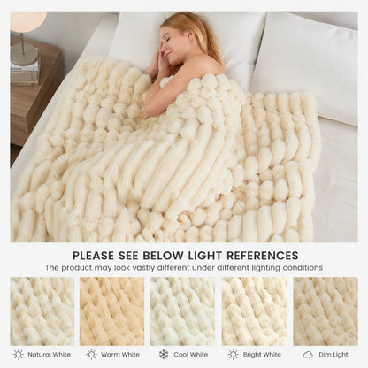 Woman sleeping under a textured beige blanket in a bedroom setting.