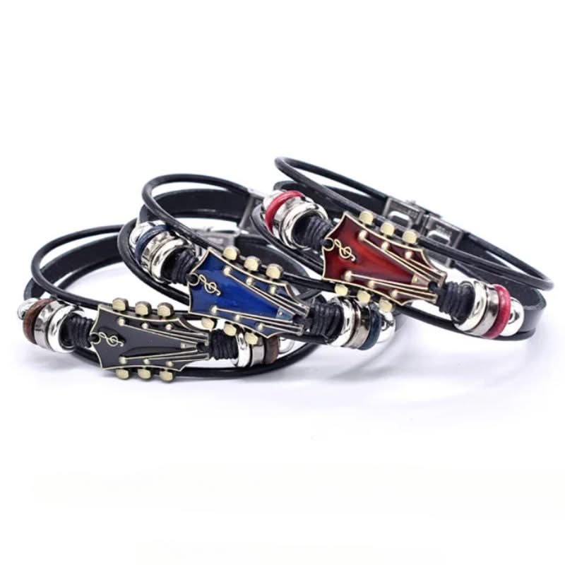 Three leather bracelets with metal clasps on a white background