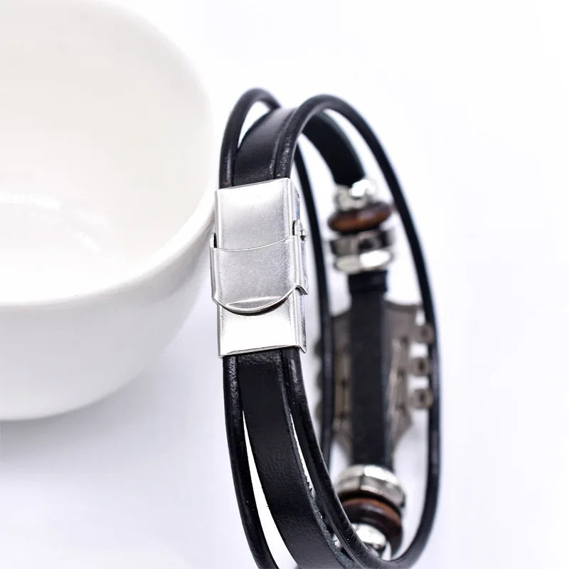 Black leather bracelet with silver clasp on a white background