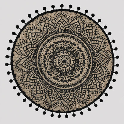 Josh & Tate - SunWeave™ Boho Mandala Placemat - A round black and beige bohemian mandala tapestry with a black pom-pom border, displayed flat against a light gray background.