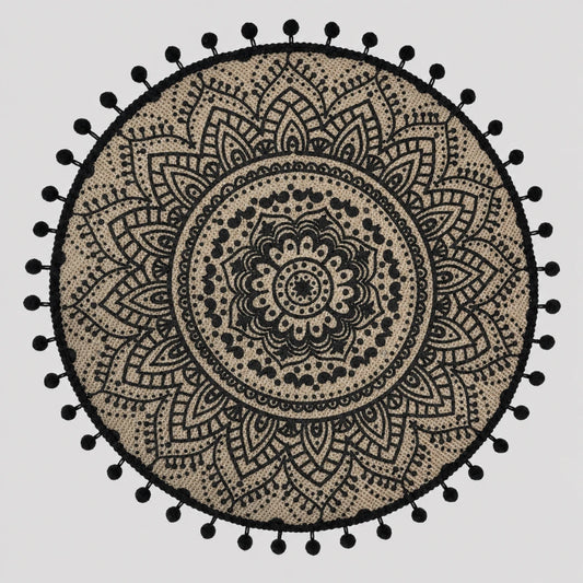 Josh & Tate - SunWeave™ Boho Mandala Placemat - A round black and beige bohemian mandala tapestry with a black pom-pom border, displayed flat against a light gray background.