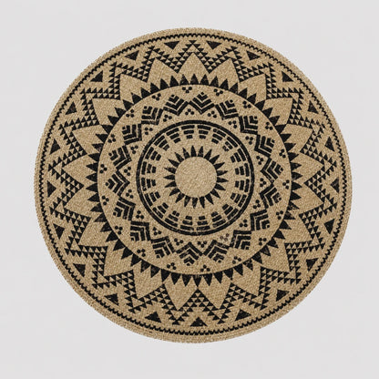 Josh & Tate - SunWeave™ Boho Mandala Placemat - A round natural fiber rug with a black geometric mandala pattern, shown flat against a light gray background.