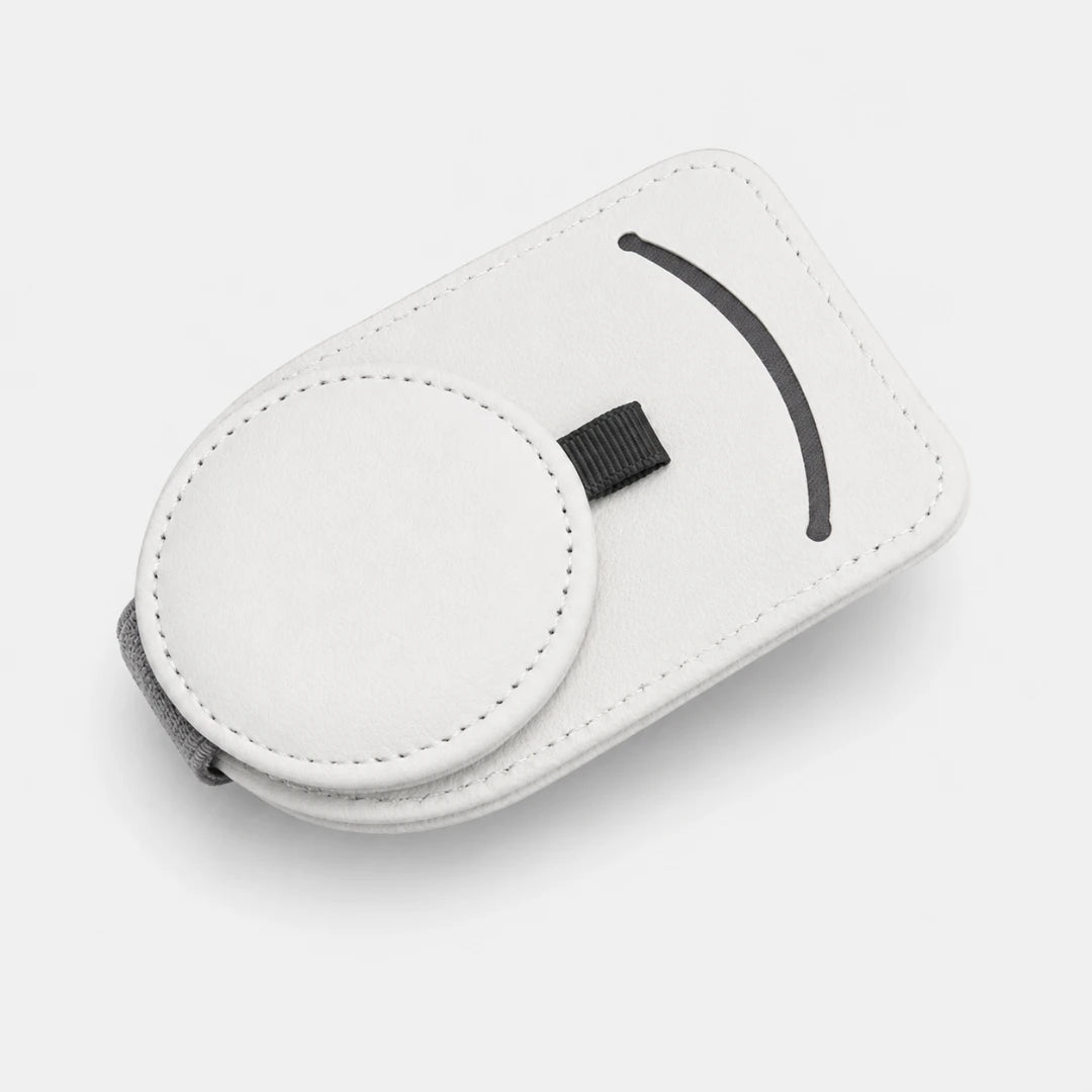 Josh & Tate - SunglassClip™ Car Visor Organizer - A white faux-leather phone pouch with a circular magnetic ring, a black elastic strap, and a black curved accent, shown on a light gray background.