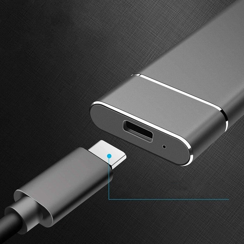 Metallic USB-C adapter on a dark textured background
