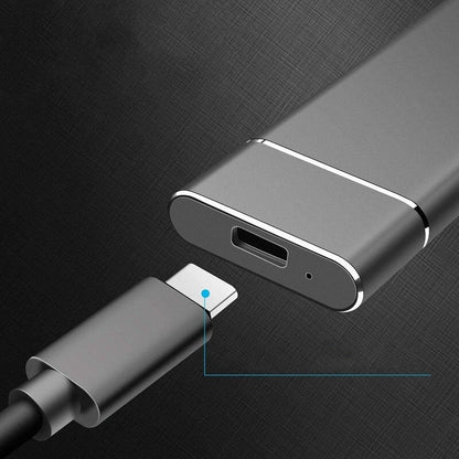 Metallic USB-C adapter on a dark textured background