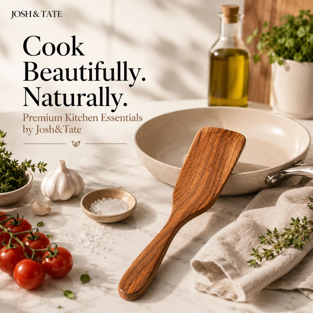 Josh & Tate - TeakFlip™ Solid Wood Cooking Spatula - Kitchen scene with a wooden spatula, pan, and ingredients on a light surface, featuring Josh & Tate branding.
