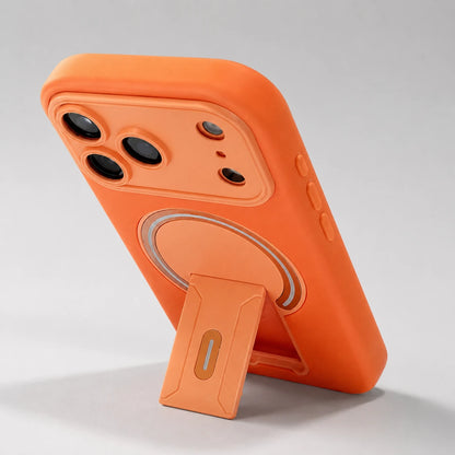 Josh & Tate - TiltPod™ iPhone Case - An orange protective phone case with a built-in kickstand, shown from a rear three-quarter angle on a light gray background.