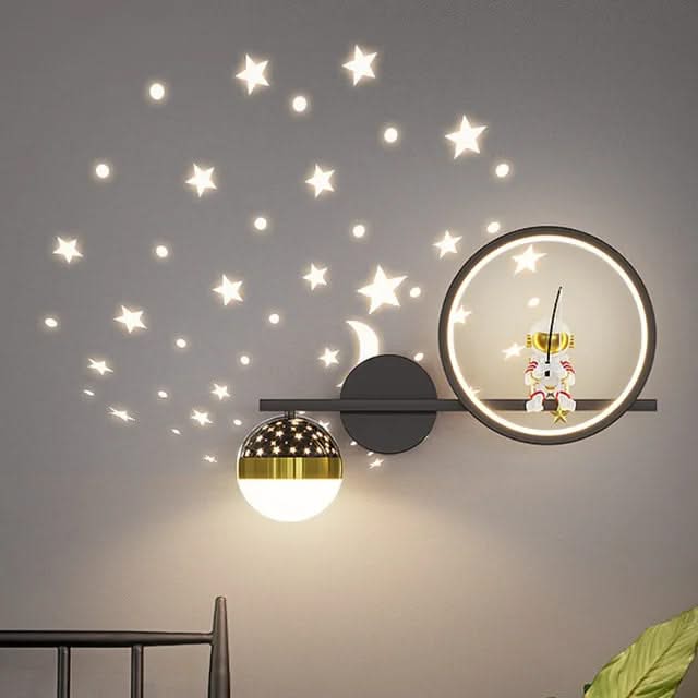 Decorative wall clock with star decals on a gray wall