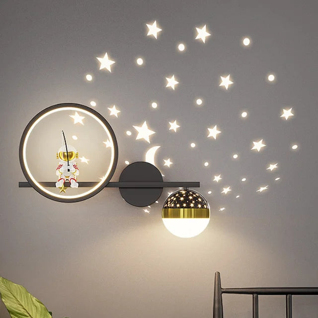Modern wall lamp with decorative star stickers on a gray wall