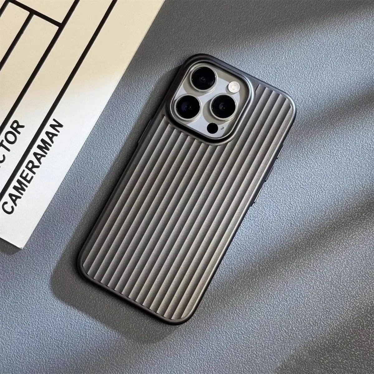 Phone case with ribbed texture on a gray surface