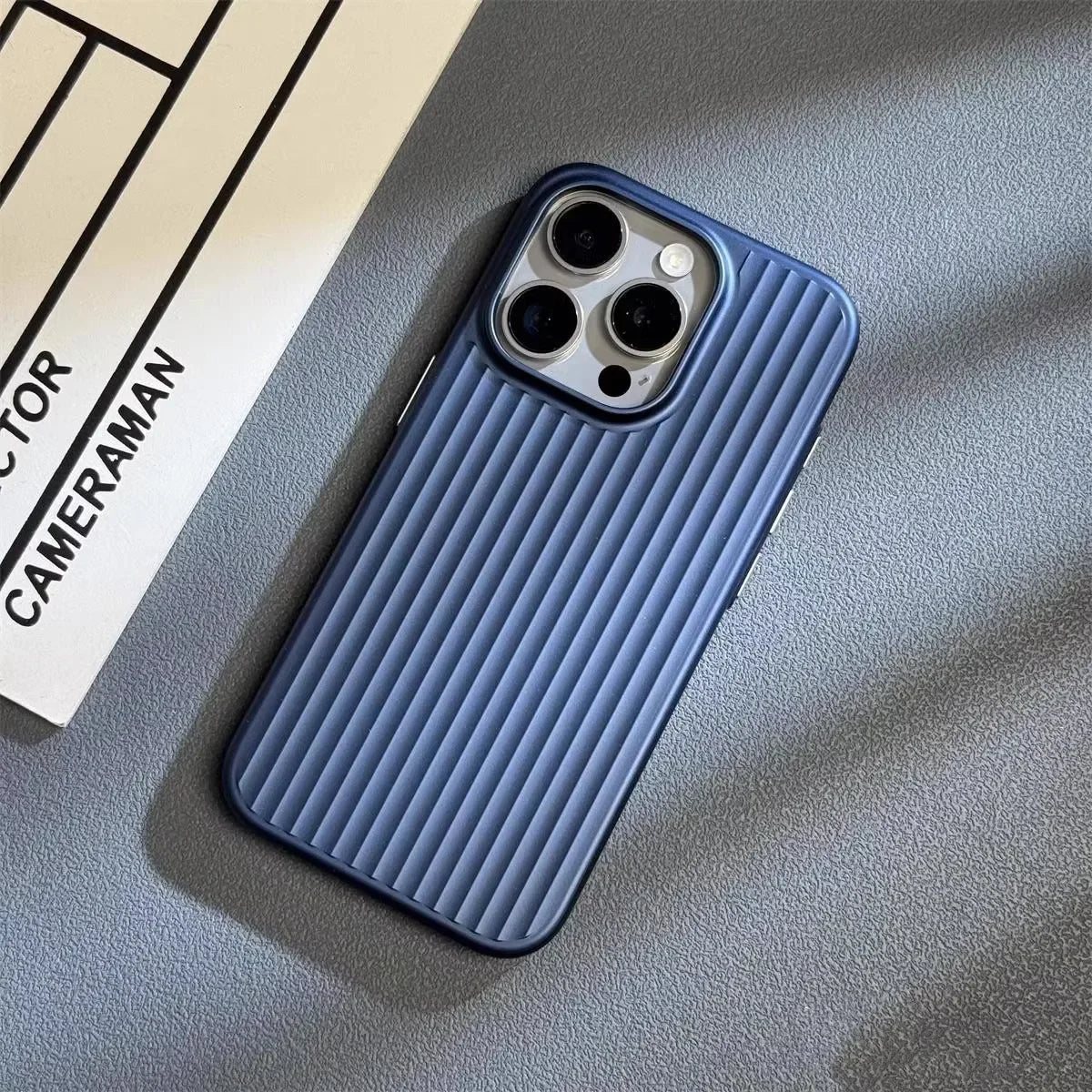 Blue phone case on a gray surface with a blurred background