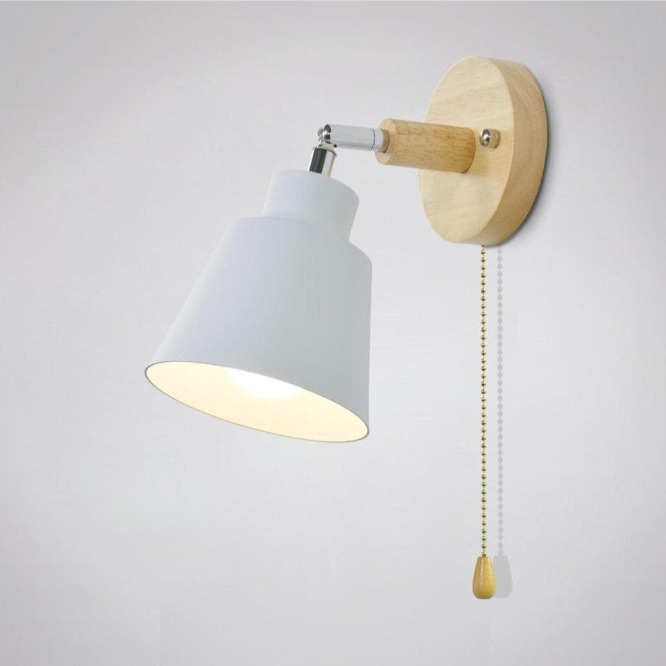 Wall-mounted lamp with white shade and wooden arm on a light gray background