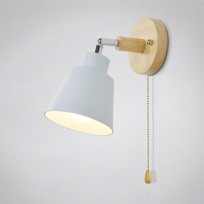 Wall-mounted lamp with white shade and wooden arm on a light gray background