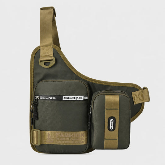 Josh & Tate - UrbanCore™ Crossbody Bag - An olive green and khaki tactical sling bag with an attached front zippered pocket and a smaller side pouch, shown on a light gray background.