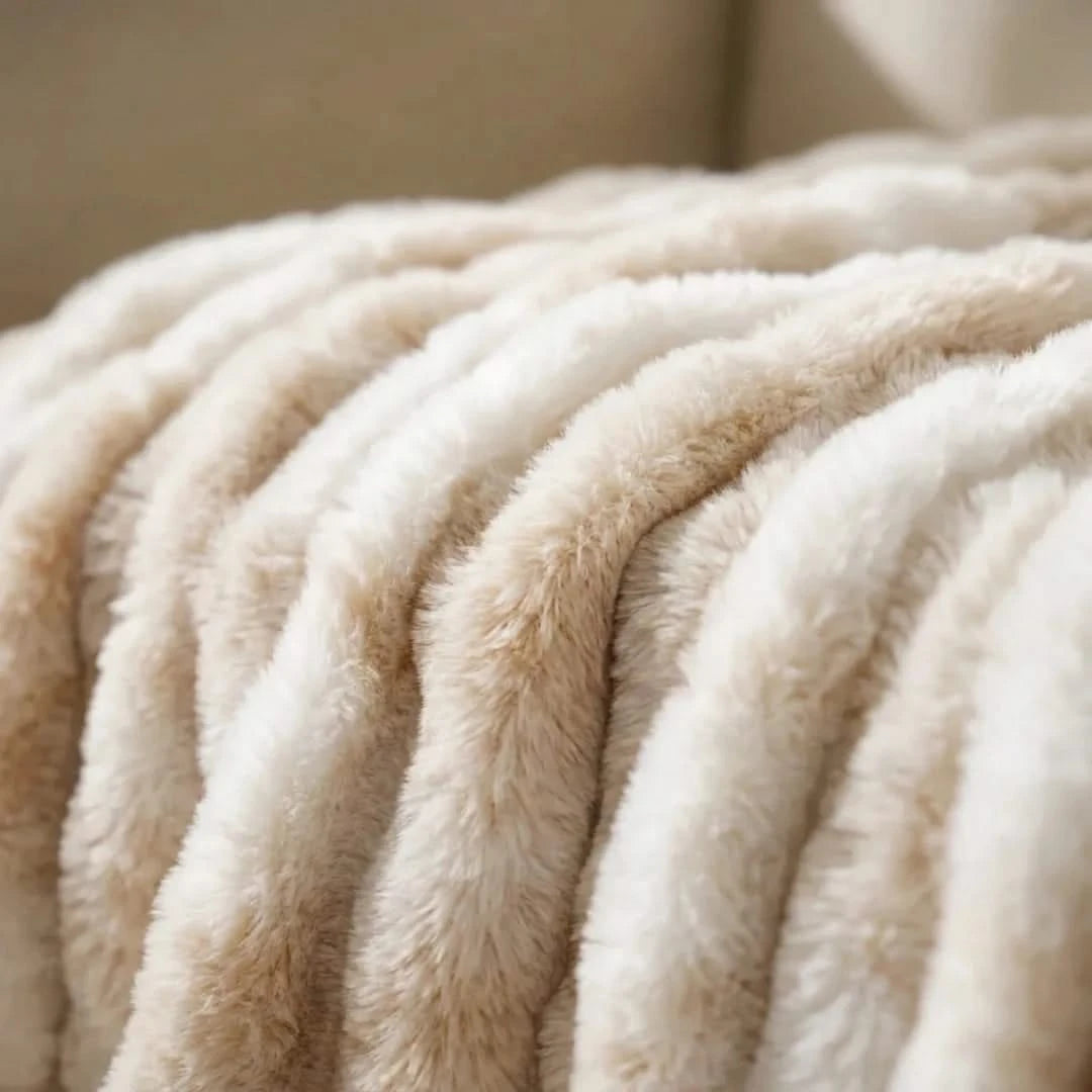 Josh & Tate - VelvetRib™ Faux Fur Throw Blanket - Close-up of a beige blanket with soft texture