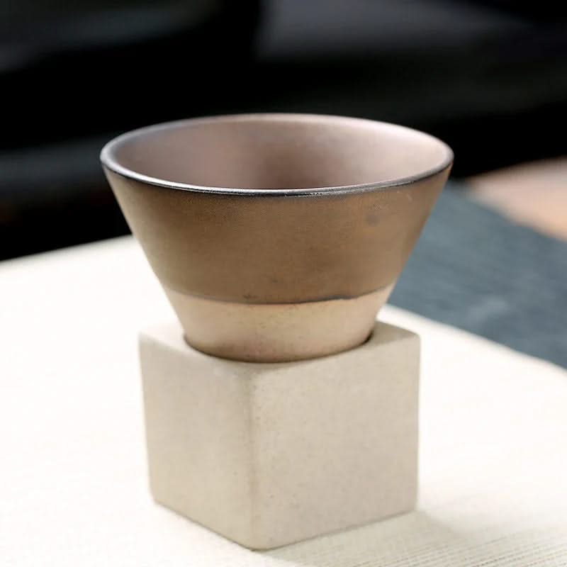 Ceramic bowl on a white surface with a blurred background