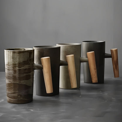 Set of modern vases with wooden handles on a gray background