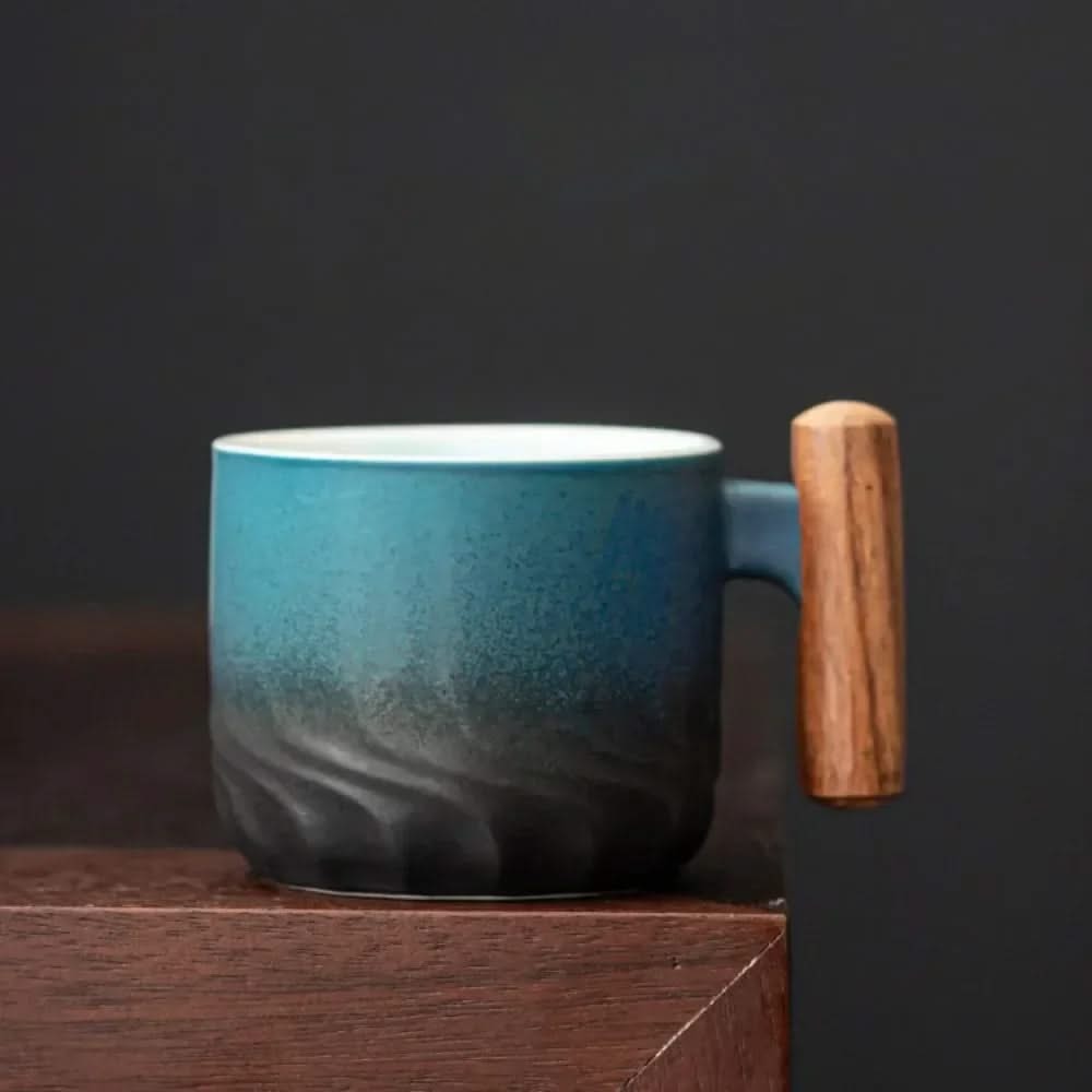 Blue mug with a wooden handle on a dark background