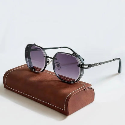 Sunglasses with dark lenses on a brown leather case against a light gray background