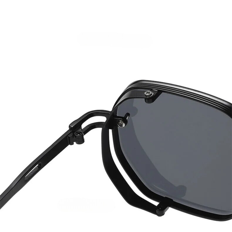 Close-up of a black sunglasses with reflective lenses on a white background