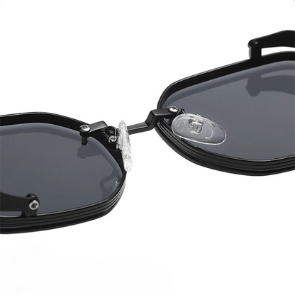 Black sunglasses with a reflective lens on a white background