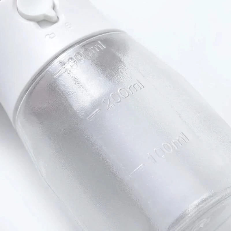 Josh & Tate - WalkPod™ 3-in-1 Dog Travel Bottle - Close-up of a white water bottle with measurement markings on a light gray background