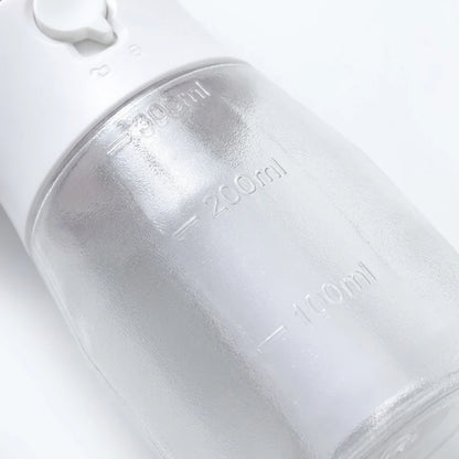 Josh & Tate - WalkPod™ 3-in-1 Dog Travel Bottle - Close-up of a white water bottle with measurement markings on a light gray background