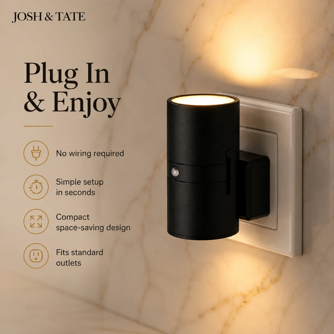 Josh & Tate - WallBeam™ Plug-In Directional Sconce - Black wall light fixture with 'Josh & Tate' branding on a marble wall.