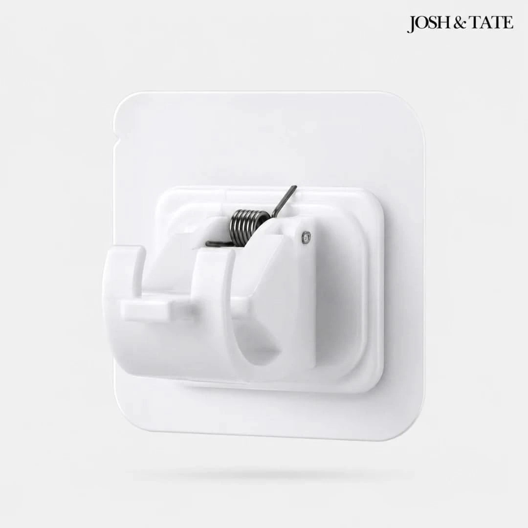 Josh & Tate - WallGrip™ Adhesive Rod Clip - White wall hook with coiled spring on a light gray background, featuring the brand 'Josh & Tate'.