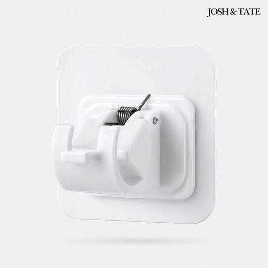 Josh & Tate - WallGrip™ Adhesive Rod Clip - White wall hook with coiled spring on a light gray background, featuring the brand 'Josh & Tate'.