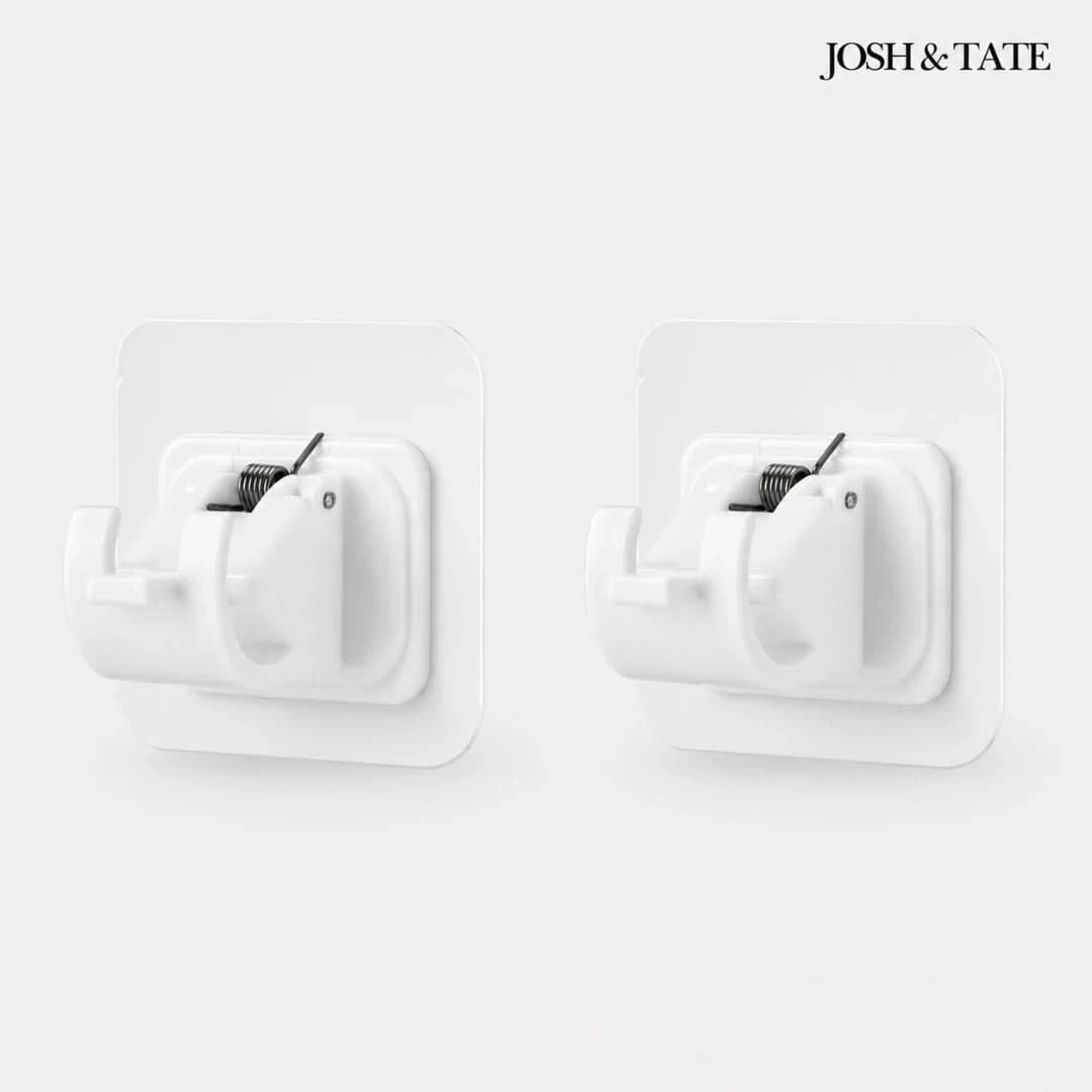 Josh & Tate - WallGrip™ Adhesive Rod Clip - White wall hooks with black metal clips on a white background, featuring the brand 'Josh & Tate'.
