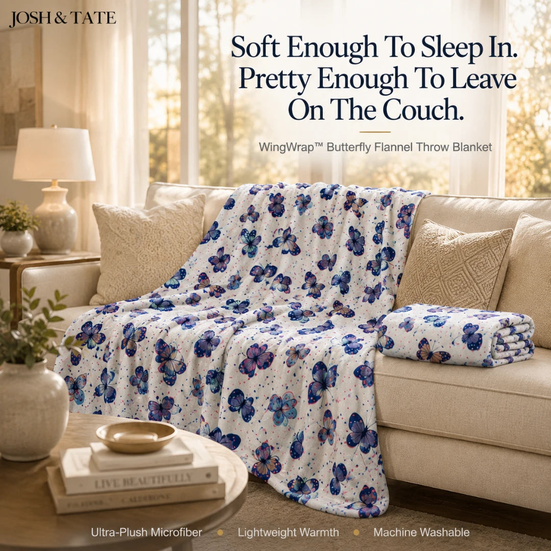 Josh & Tate - WingWrap™ Butterfly Throw Blanket - Floral-patterned throw blanket on a couch with 'Josh & Tate' branding.