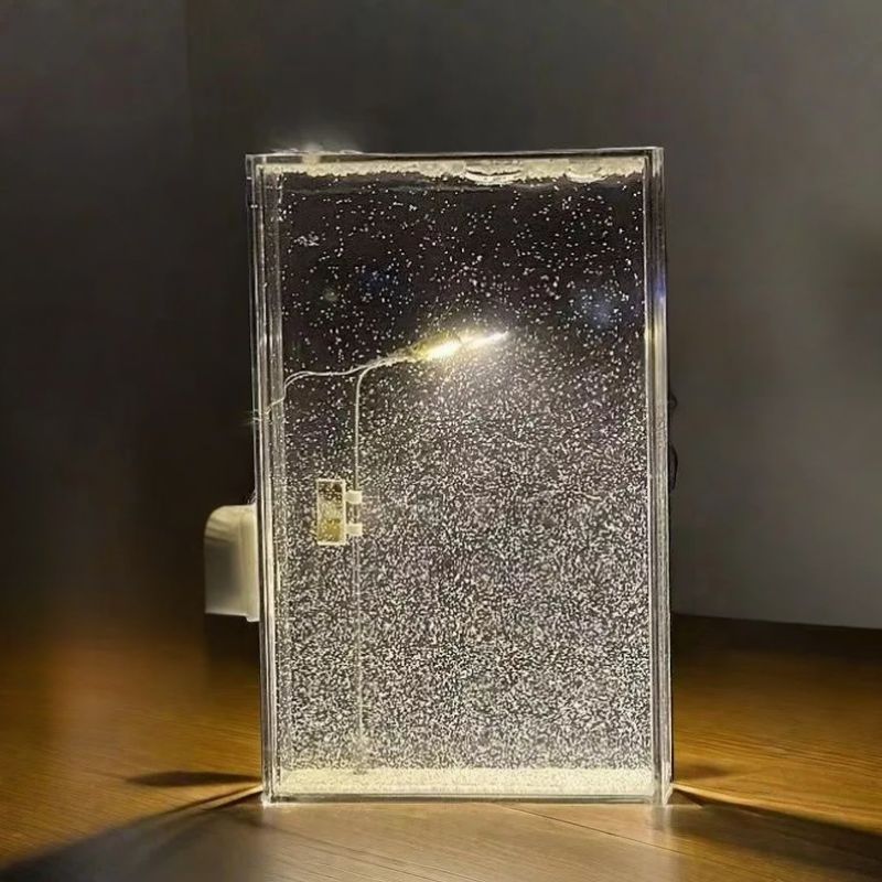 Glass panel with water droplets on a wooden surface