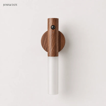 Josh & Tate - WoodGlow™ Magnetic Sensor Night Light - Wall-mounted lamp with wooden top and white base on a light gray background, branded 'JOSH&TATE'.