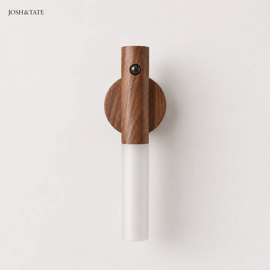 Josh & Tate - WoodGlow™ Magnetic Sensor Night Light - Wall-mounted lamp with wooden top and white base on a light gray background, branded 'JOSH&TATE'.