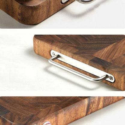 Wooden cutting board with a metal handle on a white background