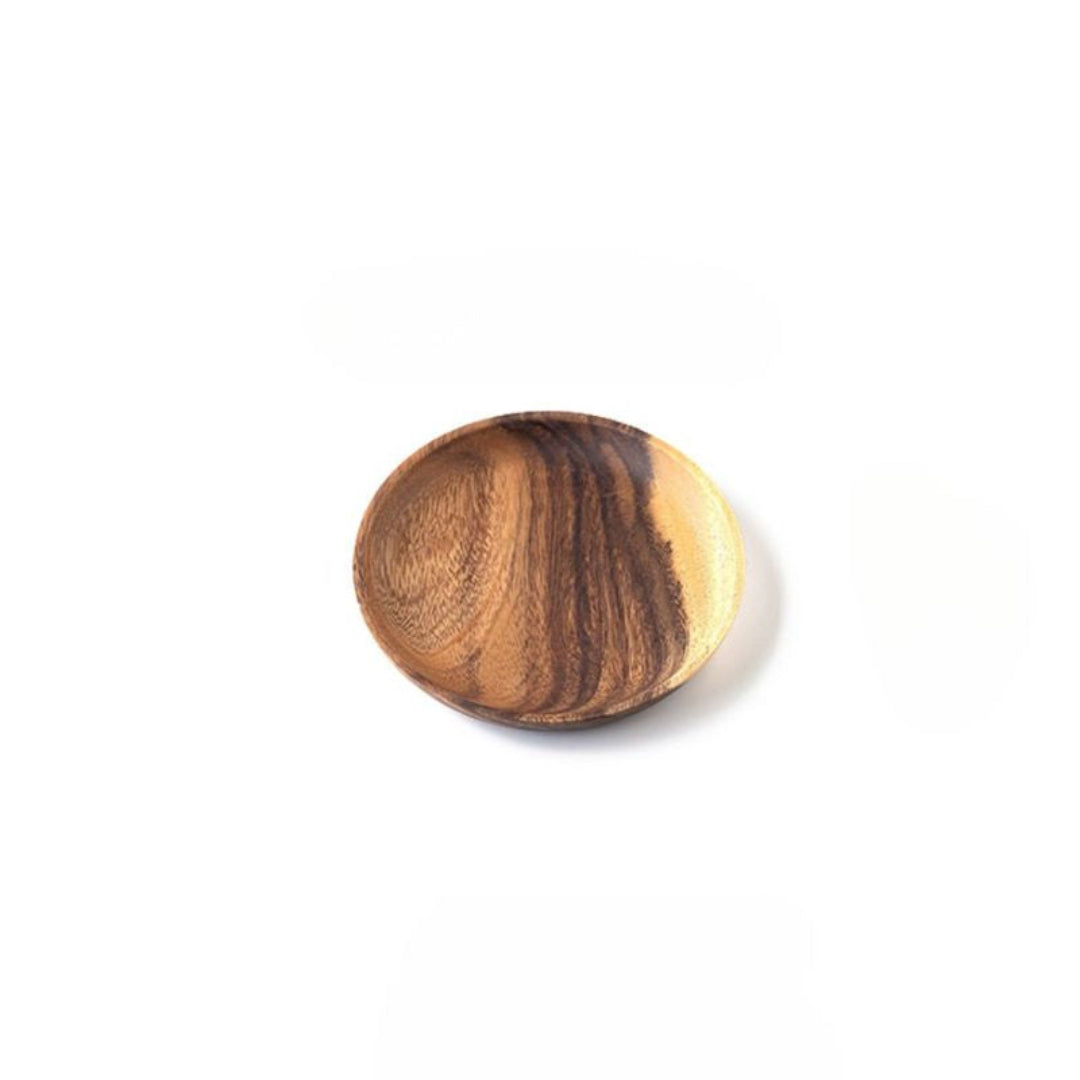 Wooden ball with a striped pattern on a white background