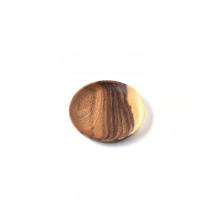 Wooden ball with a striped pattern on a white background