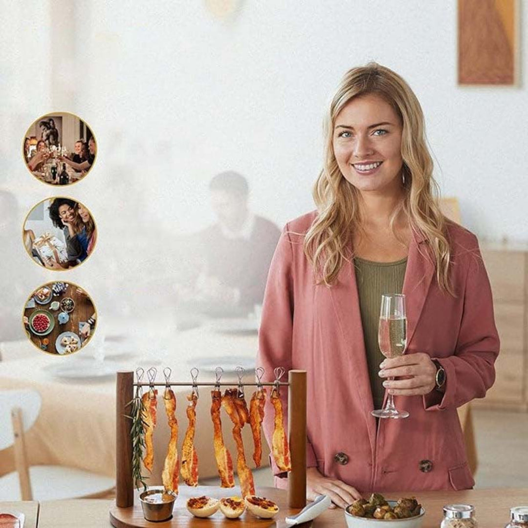 Woman holding a glass of champagne in a kitchen setting with food and decor.